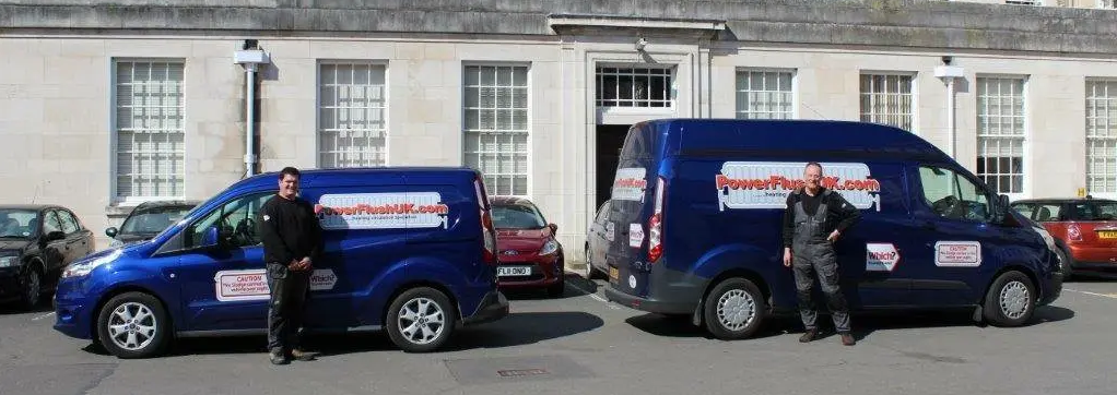 two powerflush experts and their vans